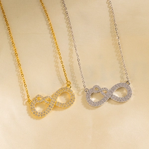 Elegant gold and silver infinity pendant necklaces with sparkling zircon pave settings
