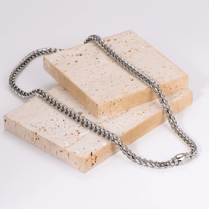 Polished silver stainless steel wheat chain necklace with magnetic clasp on stone block