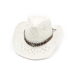 Detail of white woven cowboy hat with brown studded band and metallic floral carving