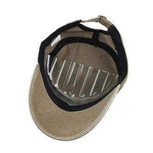 Detail of khaki cotton cadet cap interior showing sweatband and 100% cotton wash label