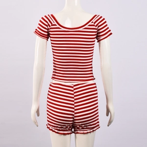 Detail view of red and white striped knit set showing backless crop top and ruffled shorts