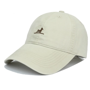 Detailed close-up of beige cotton baseball cap featuring a small brown dog embroidery