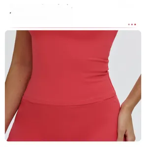 Detail of red yoga top with extended hem for waist shaping and tummy control