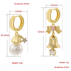 Detailed view of gold Christmas bell and star pearl drop earrings with measurements