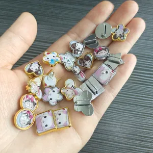 Detailed view of assorted cartoon enamel alloy charms and DIY jewelry accessories