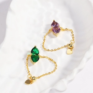 Adjustable heart gemstone chain ring in gold with green and purple pear-cut zircons