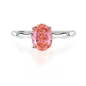 Macro shot of S925 sterling silver ring featuring a pink oval-cut gemstone in 4-prong setting