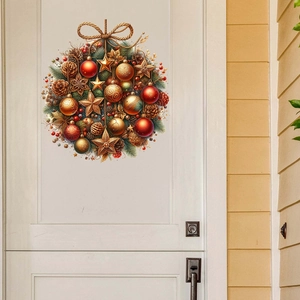 Detail of Christmas wreath wall decal with red ornaments and pine cones on a white door