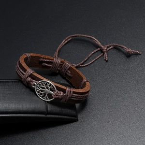 Macro view of woven Tree of Life leather bracelet with vintage brown finish and slider