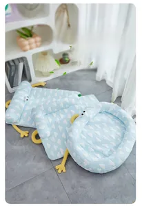 Close-up of three pet cooling mats in light blue with cloud patterns for summer