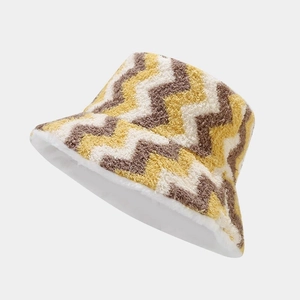 Close-up of plush zigzag pattern bucket hat with warm white fleece lining texture