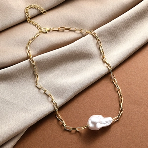 Detail of baroque pearl pendant on gold rectangle link chain with lobster clasp closure