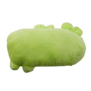 Detail view of the soft green long plush fabric texture on a dinosaur pet toy