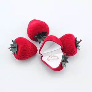 Cute red strawberry shaped velvet jewelry box with green leaf detail for rings
