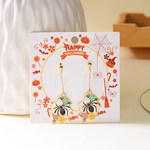 Detail of Halloween spider floral drop earrings on a festive Happy Halloween card