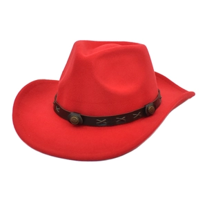 Detail of red wool cowboy hat with brown leather band and antique metal buckles