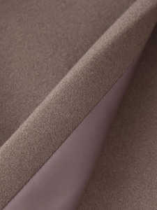Macro shot of the wool fabric texture and smooth satin lining on a brown coat