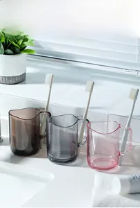 Detail of semi-transparent mouthwash cups with built-in toothbrush holder handles