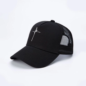 Vintage black mesh trucker hat featuring white cross embroidery and adjustable back closure