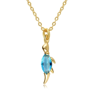 Macro detail of a 18K gold plated dolphin necklace with marquise-cut blue gemstone inlay