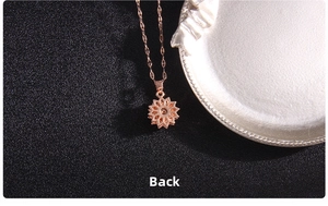 Macro detail of the rose gold clover pendant back showing the titanium steel structure