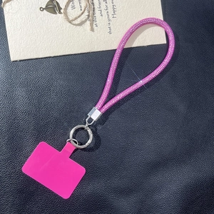 Sparkly bright pink rhinestone phone wrist strap with silver metal clasp and connector