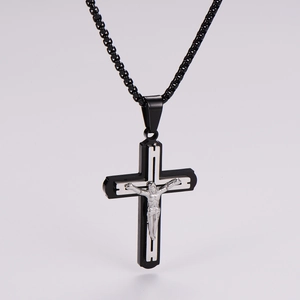 Detail of cross pendant featuring silver crucifix and black box chain for men and women
