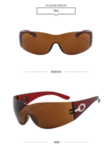 Detail view of retro futuristic tea-colored sunglasses with rhinestone accents