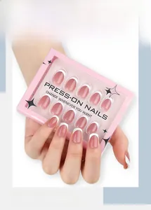 Detail showing elegant nude pink press-on nails with white French tips in star packaging