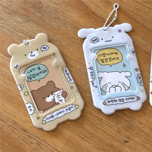 Cute cartoon bear and puppy PVC photocard holders for K-pop cards on a wooden surface