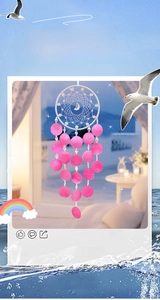 Detail of pink shell wind chime dreamcatcher with beads and silver moon pendant