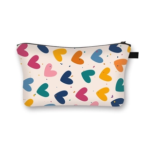 Portable Valentine heart print makeup bag with colorful patterns and black zipper