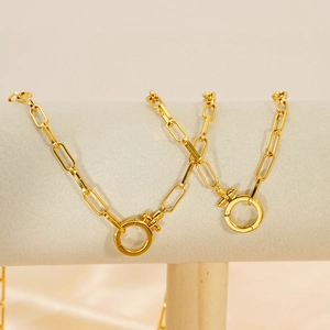 Elegant 18K gold plated paperclip chain necklace with round clasp on display stand