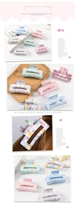 Detail of colorful bunny claw clips in pastel pink, blue, green and white matte finish