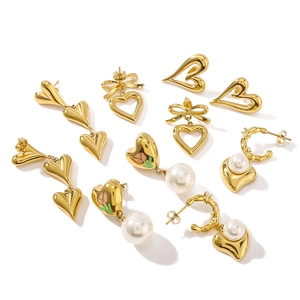 Golden titanium steel earrings set with pearls, hearts and enamel floral bow designs