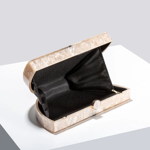 Elegant marble acrylic evening clutch bag with gold metal hardware and semi-circle design