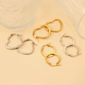 Minimalist gold and silver hoop earrings in heart and circular shapes for daily wear
