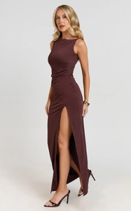 Detail view of deep chocolate sleeveless dress with side slit and elegant ruching texture