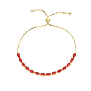 Adjustable gold-plated tennis bracelet with marquise-cut red zircon stones on a white background