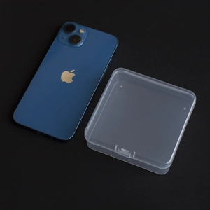 Clear square PP storage box shown next to a smartphone to demonstrate the small size