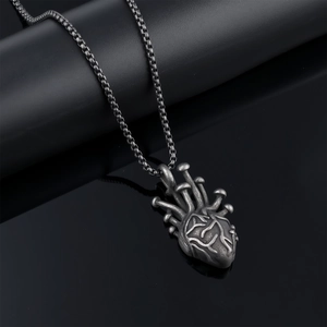Vintage style necklace featuring a mushroom heart pendant on a metallic chain