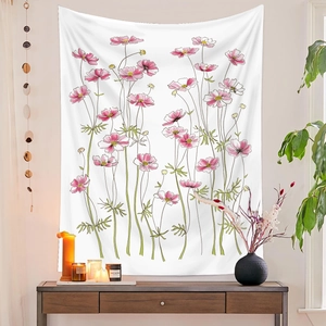 Detail of pink floral cosmos tapestry hanging on white wall in modern home decor