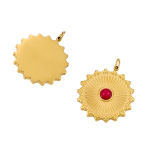 Detailed front and back view of sunburst gold pendants with a central red gemstone