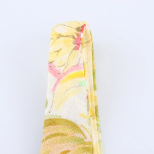 Close-up of floral print linen-blend dress strap with detailed woven texture and stitching