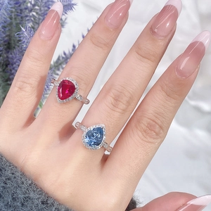 Pear-cut ruby and sapphire S925 sterling silver rings with diamond halo on silk