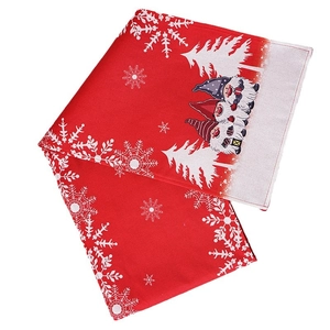 Red Christmas table runner with white snowflakes and festive forest gnome graphics