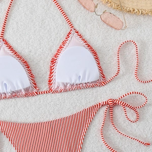 Detail of red and white striped bikini top with ruffle edges and removable pads