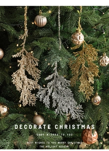 Close-up of sparkling glitter cypress leaves in gold and silver on a Christmas tree