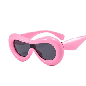Chunky pink Y2K sunglasses with bubble frame and dark lenses for fashion styling
