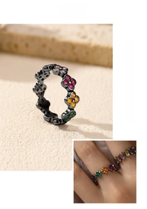 Macro detail of S925 silver black ring with multi-color clover stones and hallmark
